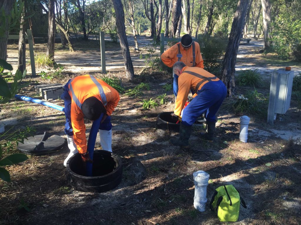 Image of septic professionals applying exceptional septic additives and treatments.