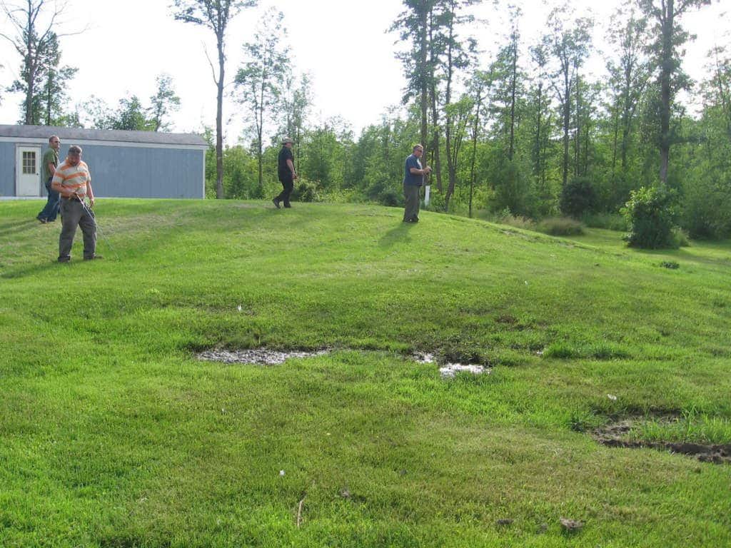 Image of a leaking sand mound.