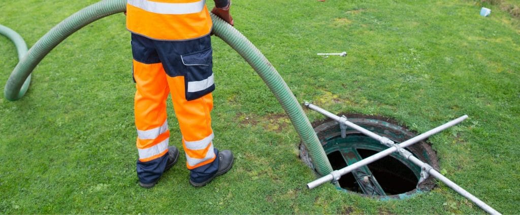 Image of septic tank chemicals being administered into the septic tank.