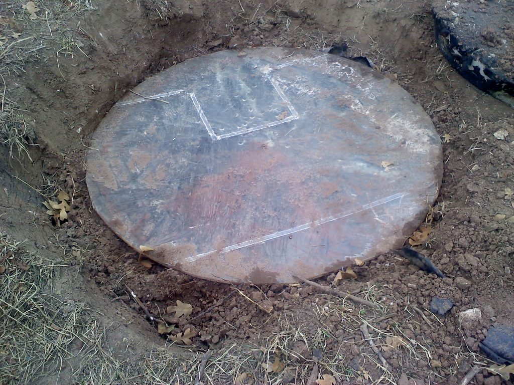 Image of a septic lid.