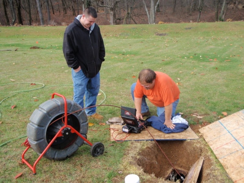 Image of a septic tank being inspected.