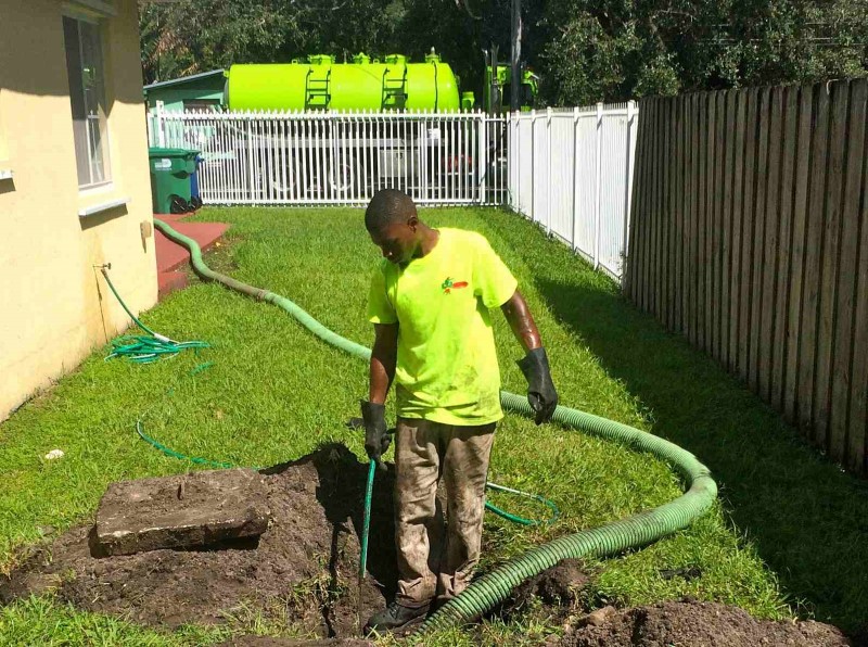 Image of a septic being maintained by a professional.