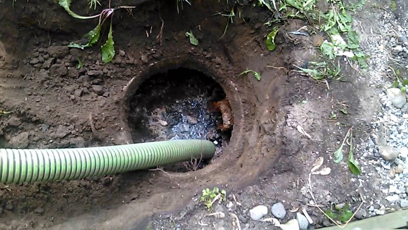 Image of a septic system being pumped.