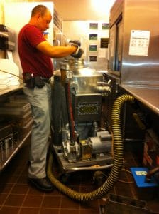 Image of cafeteria grease trap maintenance.