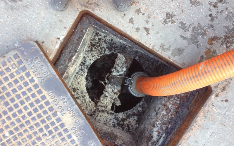 Image of cafeteria grease trap maintenance.