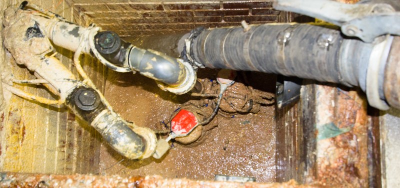 Image of grease trap flooding in a sports arena.
