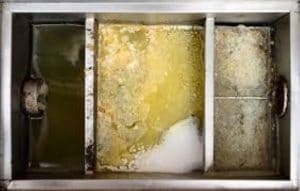 Image of a grease trap backing up in a retirement home.